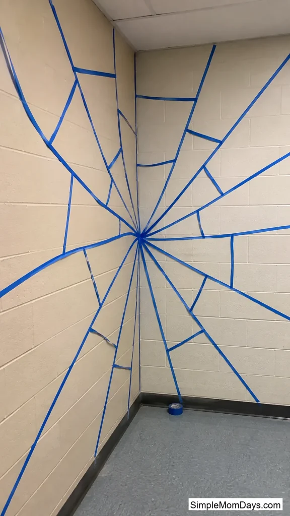 A Painter's Tape Spiderweb in the Corner