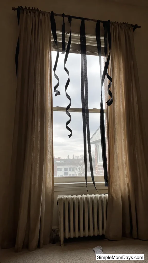 Black Crepe Paper Down the Curtain Rod